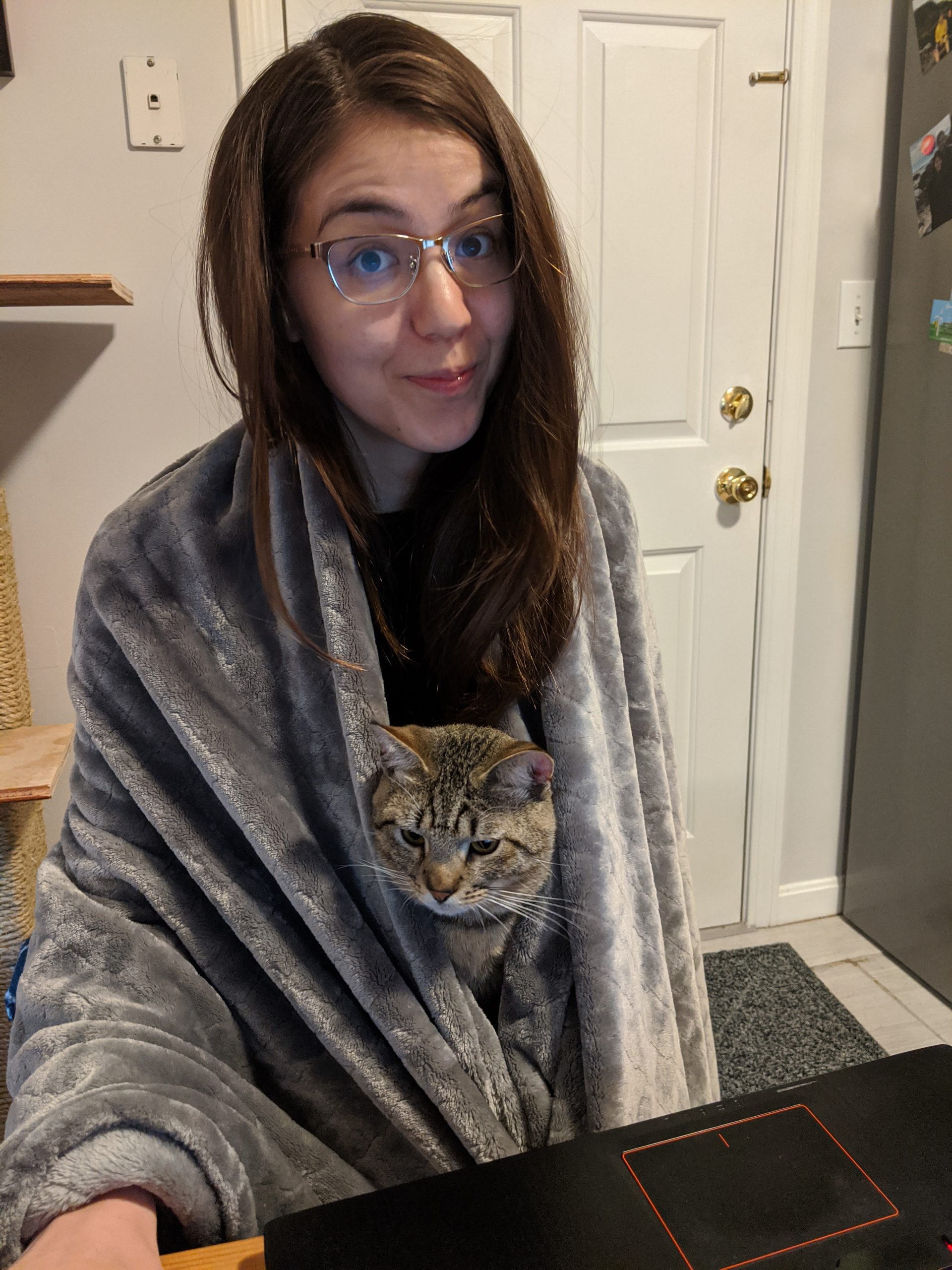 Erika Handy working from home with her cat